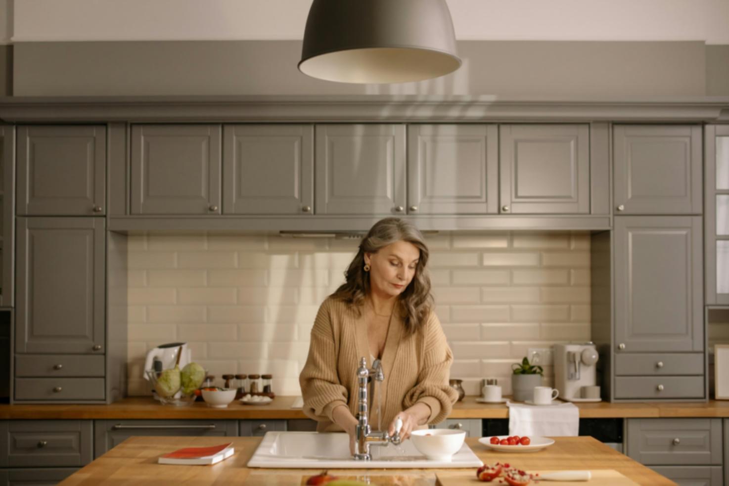 Close-up of hands kneading dough on wooden surface