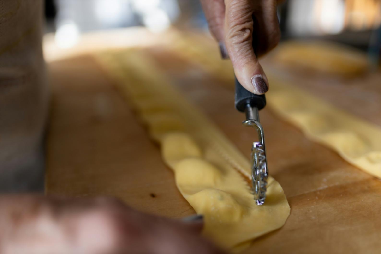 Our welcoming kitchen classroom space with natural lighting and organized cooking stations
